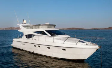 Ferretti 46 exterior side profile, private yacht cruise in Paros.