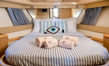 Master cabin on a Ferretti 46, private yacht cruise in Paros.