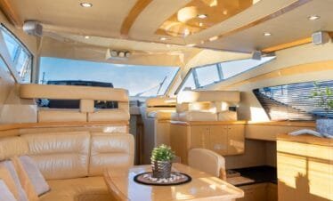 Main salon lounge on a Ferretti 46 yacht, private yacht cruise in Paros.