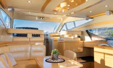 Main salon lounge on a Ferretti 46 yacht, private yacht cruise in Paros.